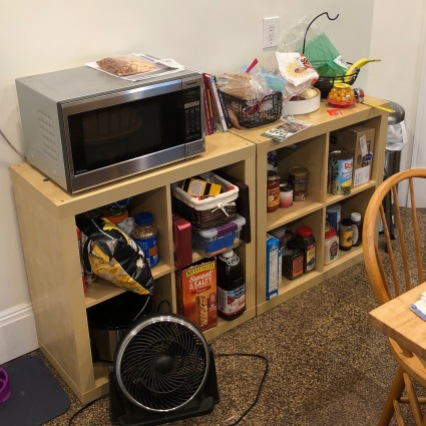 Before: A messy kitchen shelf by the mudroom.